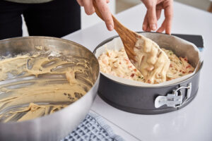 woman pouring dough bowl baking cake cooking process kitchen